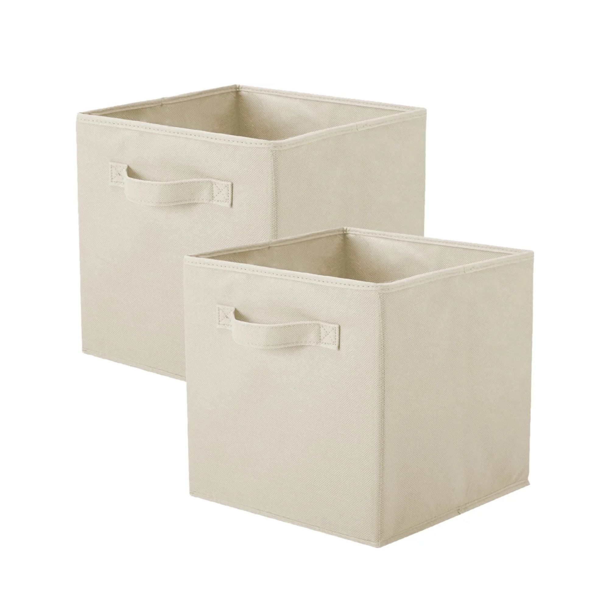 Deux poubelles de rangement en tissu beige tournées vers la gauche, avec des poignées à l'avant