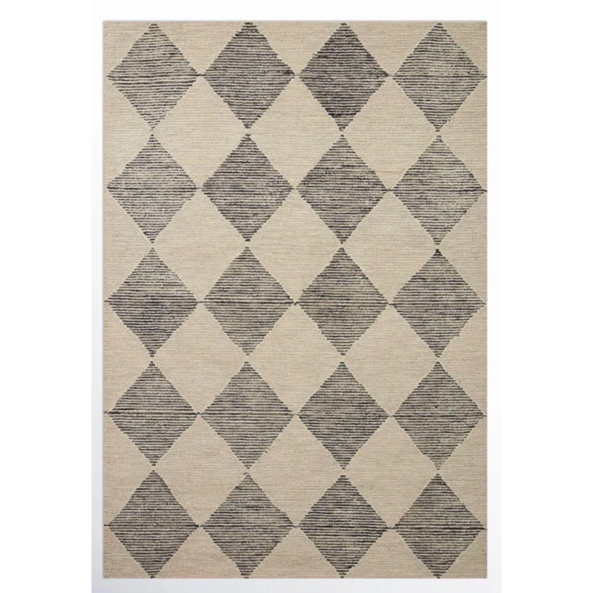 Un tapis en laine à carreaux en noir et blanc
