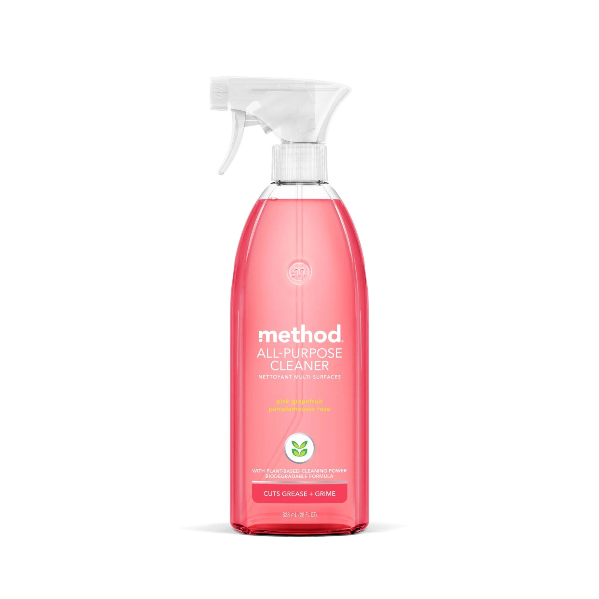 Une bouteille de méthode nettoyage par pulvérisation avec du liquide rose à l'intérieur
