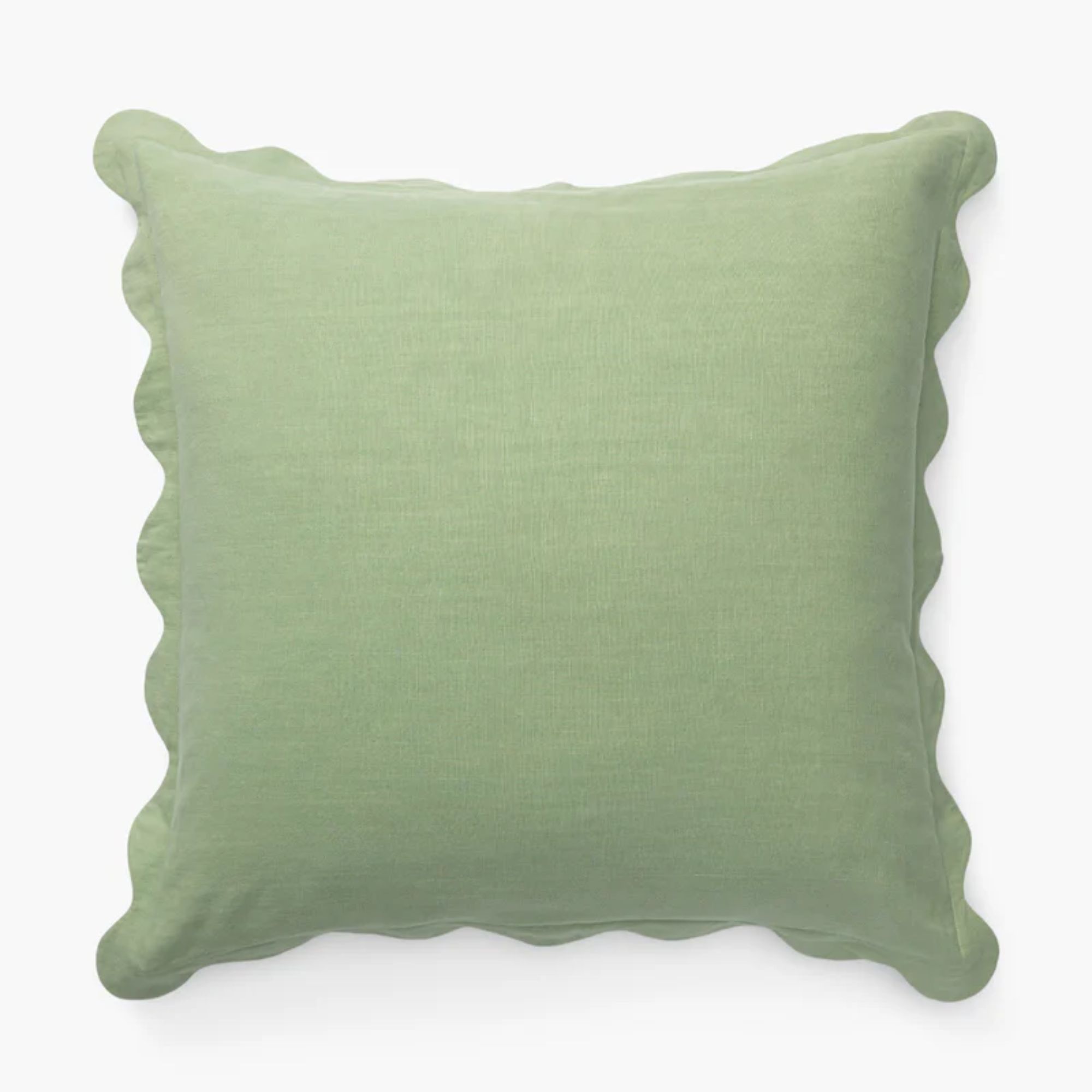 coussin carré vert clair avec des bords festonnés