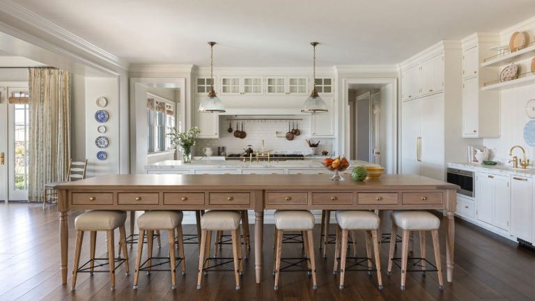 kitchen white units wooden island table and hardwood floor