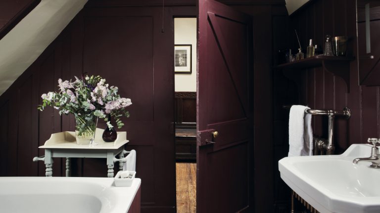 aubergine eggplant bathroom with white bath, sink, side table, shiplap walls, shelving, towel storage, Farrow &amp; Ball