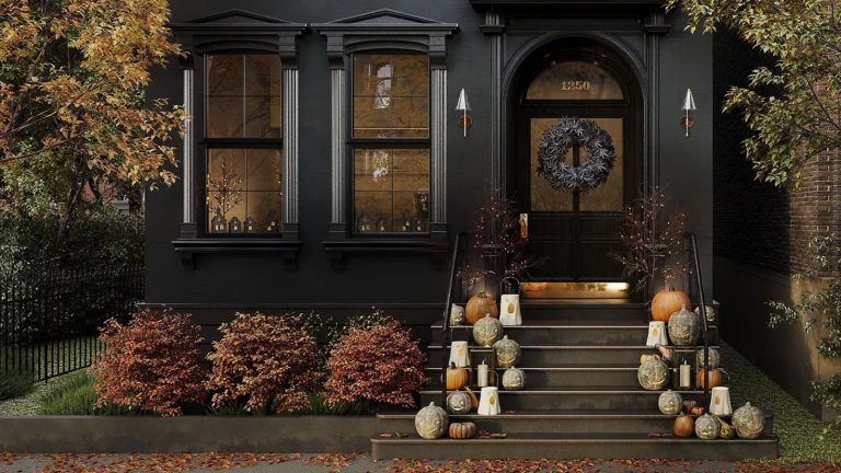 black painted house front with Halloween decorations on the steps and door