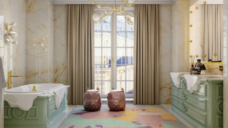 Marble walled bathroom with ornate green vanity and bath, with colorful abstract rug on floor, floor to ceiling windows and curtains, with gold accents