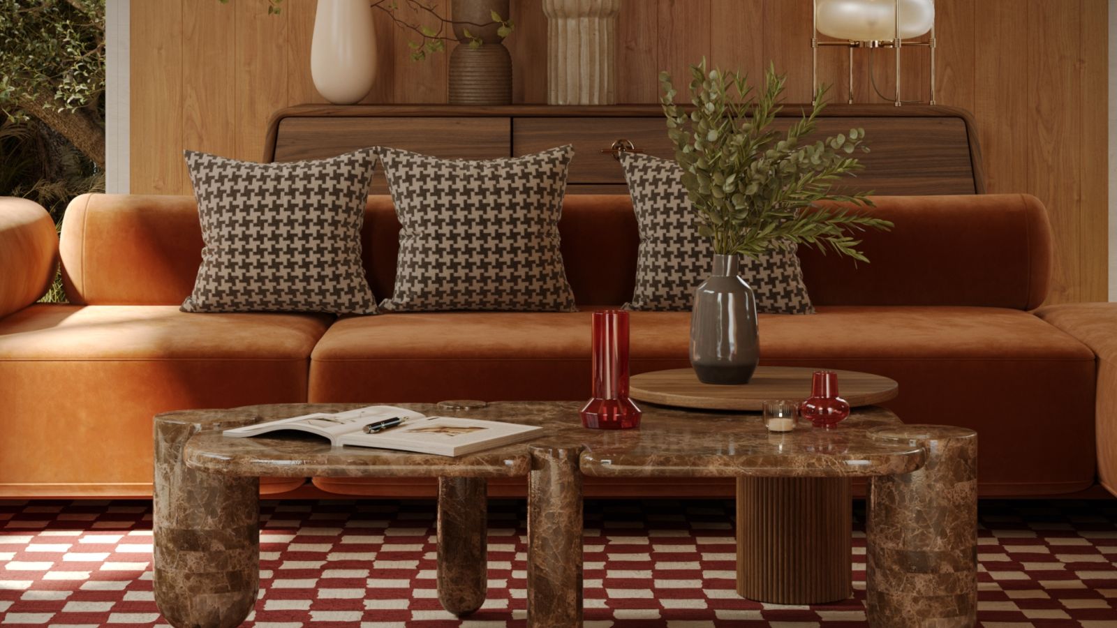 Salon aux accents du milieu du siècle comprenant une table en pierre arrondie, un canapé orange et une armoire en bois arrondie