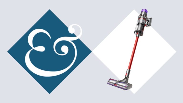 Dyson V11 Outsize on tile background next to Homes &amp; Gardens '&amp;' logo.
