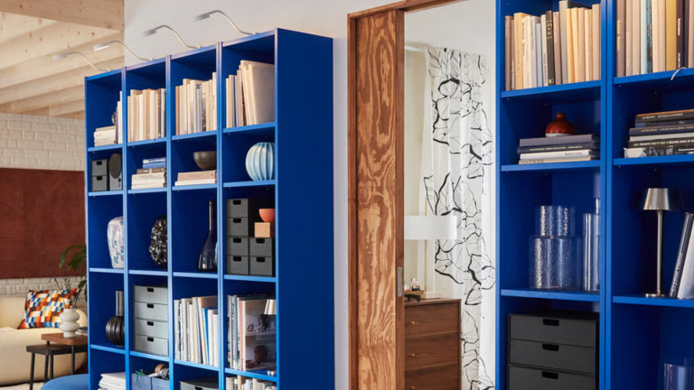 a bright blue bookcase with decor on it from IKEA