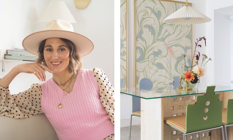 Rencontrez nos prochains gagnants en design : Atelier Akuko Designer Judith Achumba-Wöllenstein in a pink vest and hat next to a dining area with a travertine table, green geometric chairs, and botanical wallpaper.