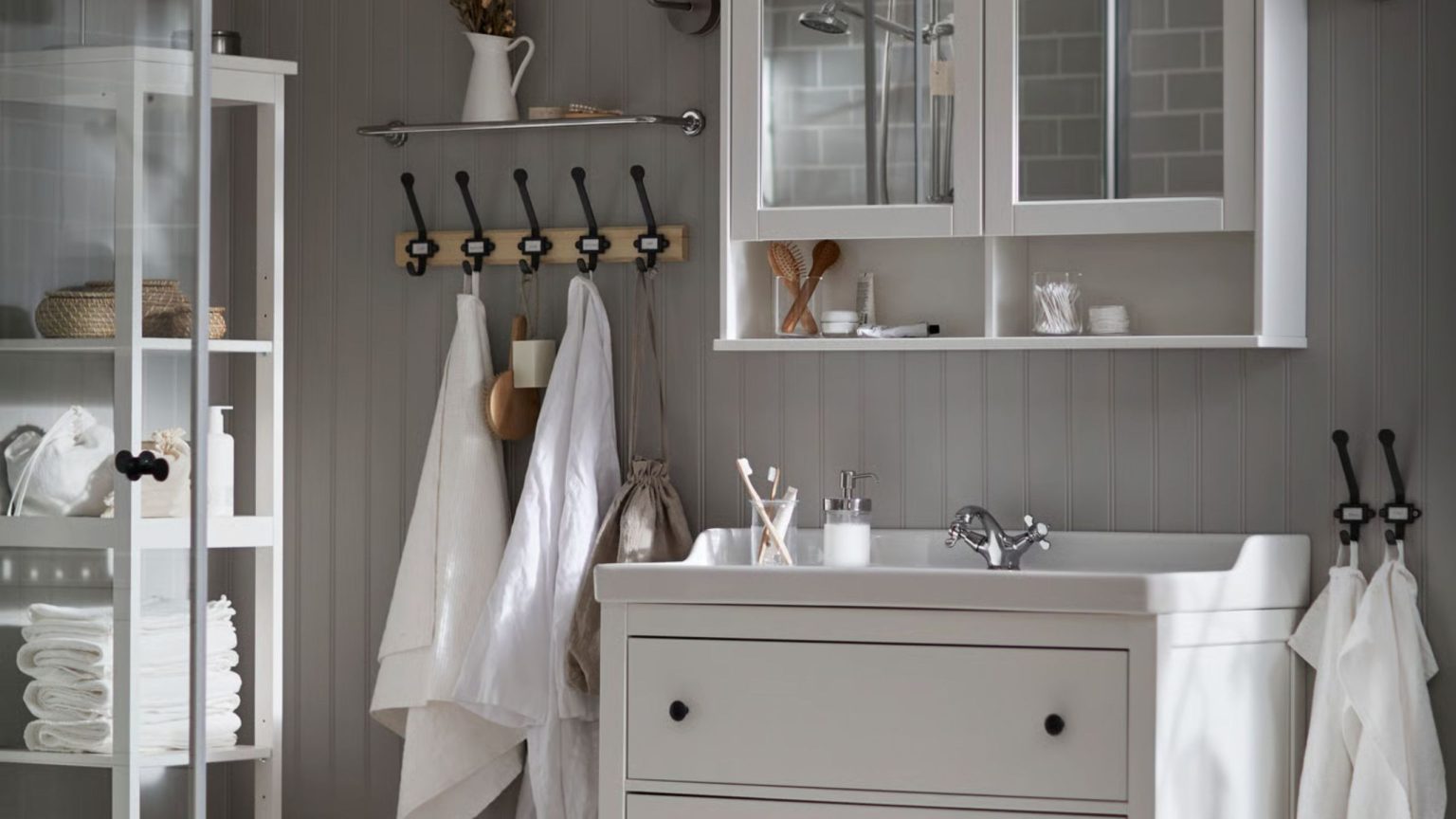 Neutral IKEA bathroom with white storage units