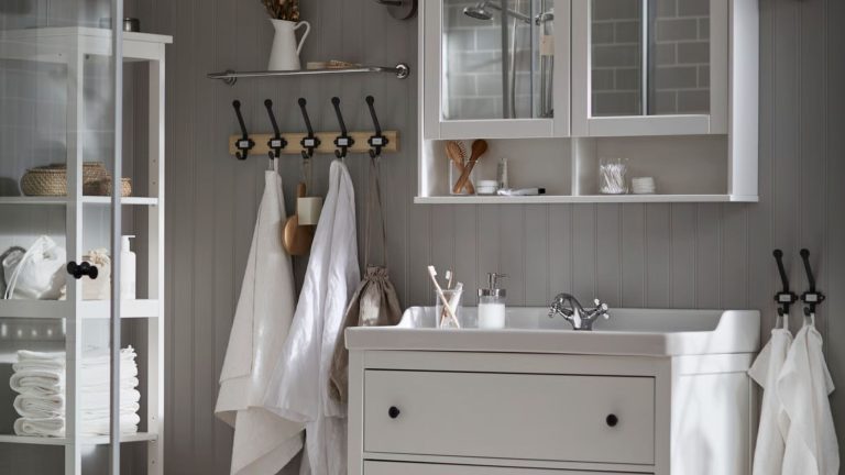 Neutral IKEA bathroom with white storage units