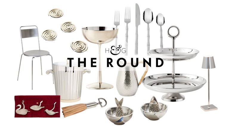 Silver summer hosting essentials, including lemon squeezers, an indoor-outdoor chair, spiral coasters, a cocktail coupe, bamboo-handle cutlery, and a portable lamp, pictured against a white background