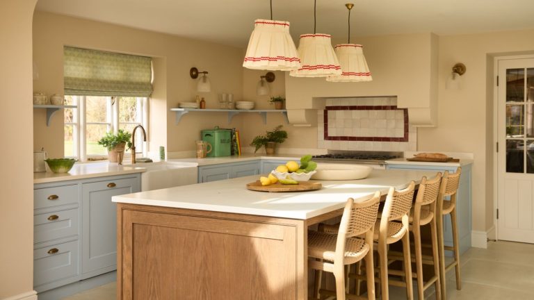 A blue and yellow kitchen with red accents