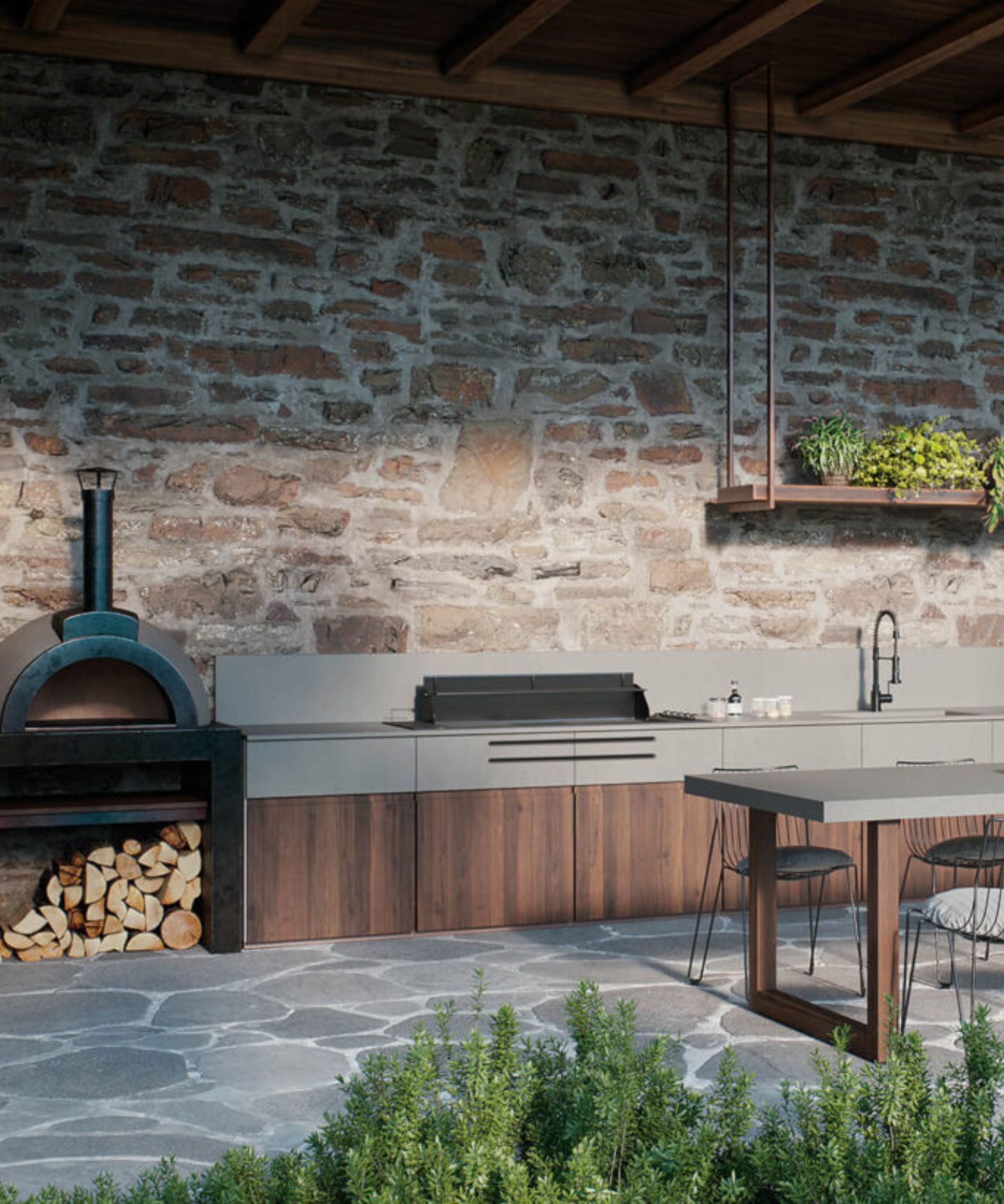 Cuisine extérieure avec mur en pierre rustique et armoires en bois sombre avec comptoir en pierre grise