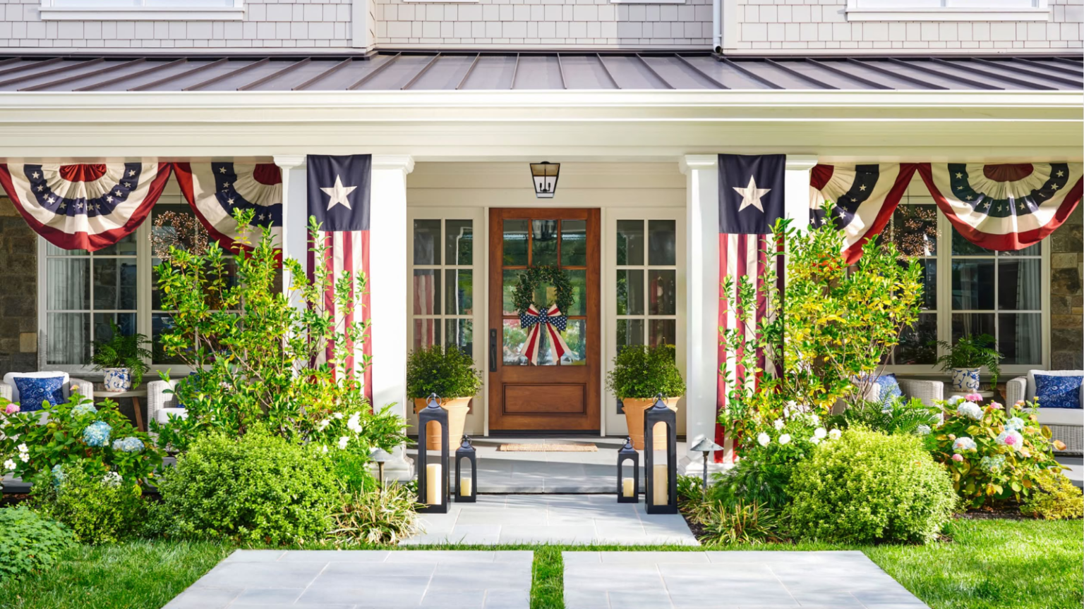 A large front porch decorated for 4th of July